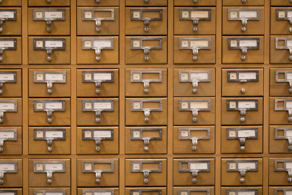 Close-up of small wooden drawers with metal heandles